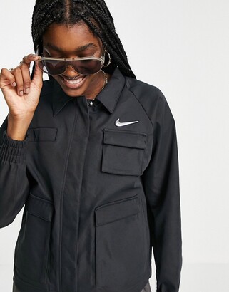 Nike Swoosh woven jacket in black with utility pockets - ShopStyle