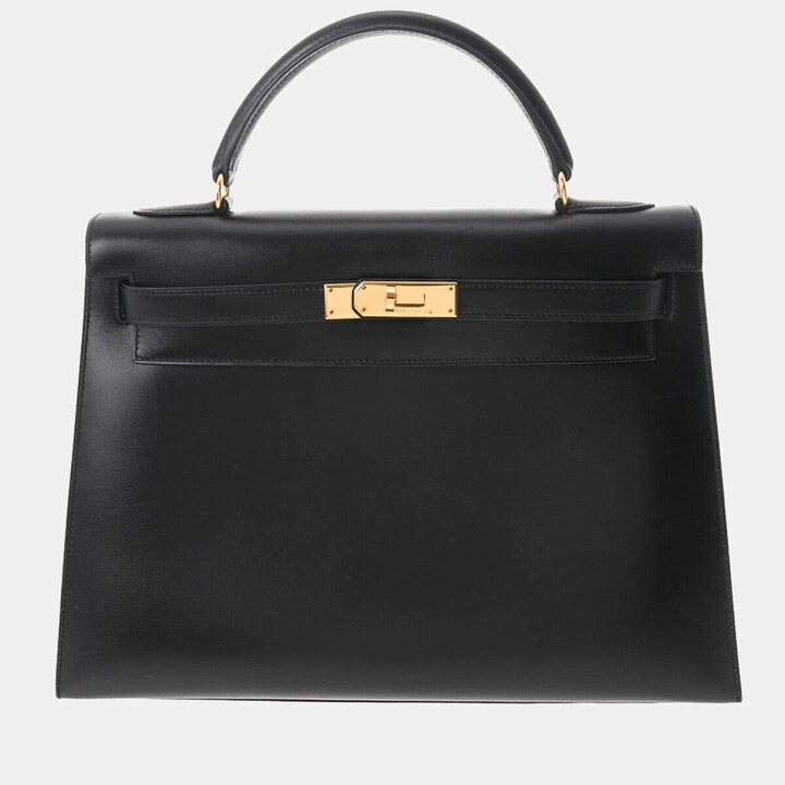 Lot - Hermes Kelly Sellier Handbag, c. 1987, in natural black box calf  leather with gold hardware, opening to a matching leather lined int