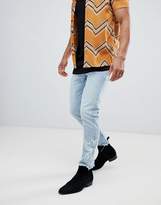 Thumbnail for your product : ASOS Design Slim Jeans In Light Wash Blue With Western Embroidery