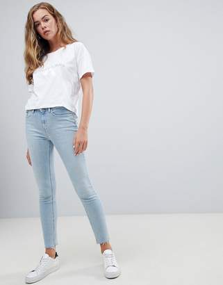 Calvin Klein high rise slashed skinny jeans