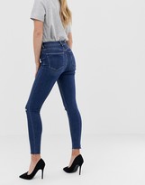 Thumbnail for your product : ASOS DESIGN Ridley high waisted skinny jeans in dark wash blue with ripped knee detail