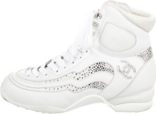 Chanel Coco Neige High Top Wedge Sneakers From the 2023 Collection by Virginie Viard Metallic & White Calfskin Interlocking CC Logo Crystal & Mesh Accents Round-Toes Lace-Up Closure at Uppers Includes Box & Dust Bag Designer