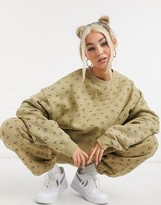 Thumbnail for your product : Nike all-over logo print cropped sweatshirt in camel