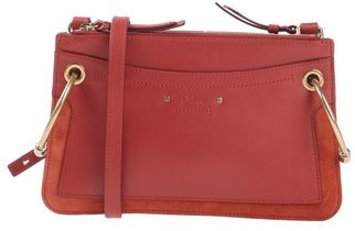 rust coloured clutch bag