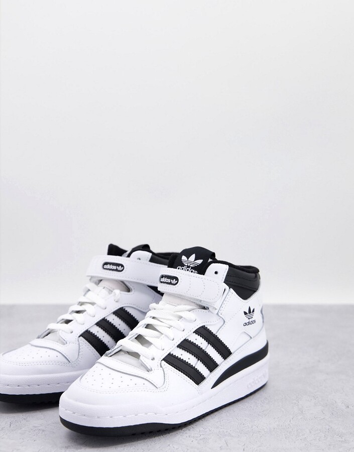 adidas Forum Mid sneakers in white and black - ShopStyle