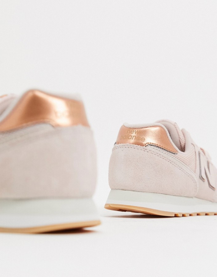 New Balance 373 sneakers in pink and rose gold - ShopStyle