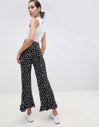 ASOS Tall DESIGN Tall trousers with fluted ruffle hem in spot print