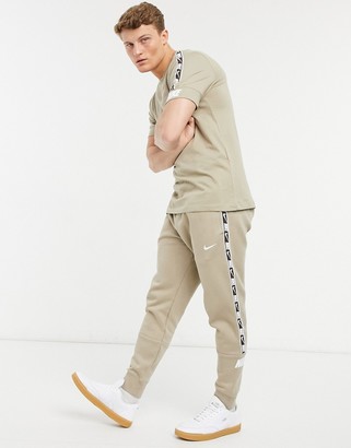 Nike Repeat Pack taping cuffed sweatpants in dusty khaki - ShopStyle  Activewear Pants