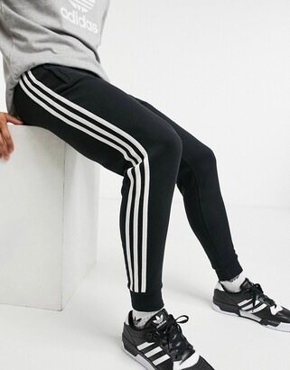 adidas three stripe sweatpants in black - ShopStyle Activewear Pants