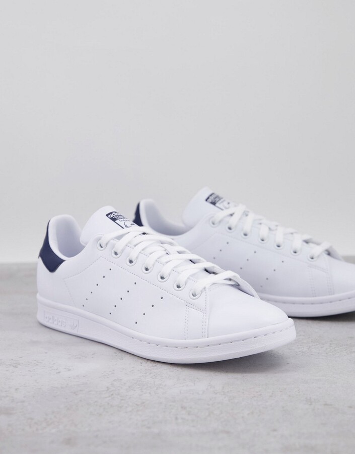 adidas Stan Smith sneakers in white with navy heel tab - ShopStyle