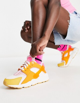 Nike Air Huarache trainers in white and hype pink solar mix - ShopStyle