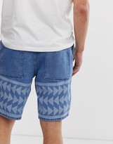 Thumbnail for your product : ASOS DESIGN relaxed fit denim shorts in mid wash blue with print