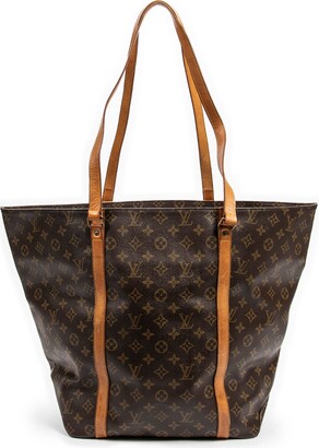 Shopping handbag Louis Vuitton Brown in Plastic - 33576251