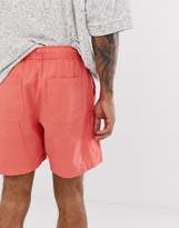 Thumbnail for your product : ASOS Design DESIGN slim shorts in washed pink with cargo pocket
