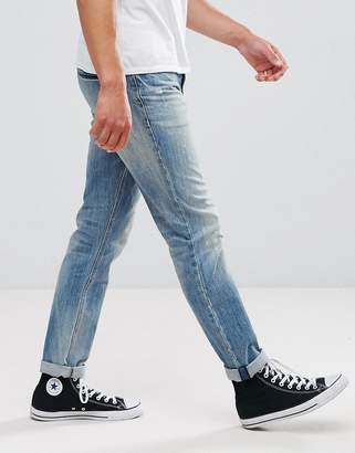 ASOS Design Slim Jeans In Mid Wash Vintage With Abrasions