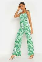 Thumbnail for your product : boohoo Shirred Tie Shoulder Palm Print Culotte Jumpsuit
