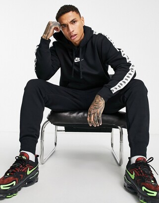Nike Repeat logo taped fleece tracksuit set in black - ShopStyle Trousers