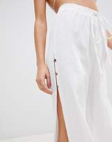Thumbnail for your product : ASOS Design DESIGN beach pants in linen with side split & tortoiseshell buttons