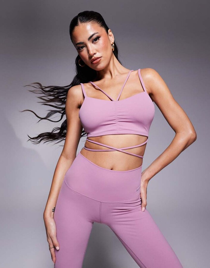 Nike Training Zenvy Yoga strappy wrap light support sports bra in pink