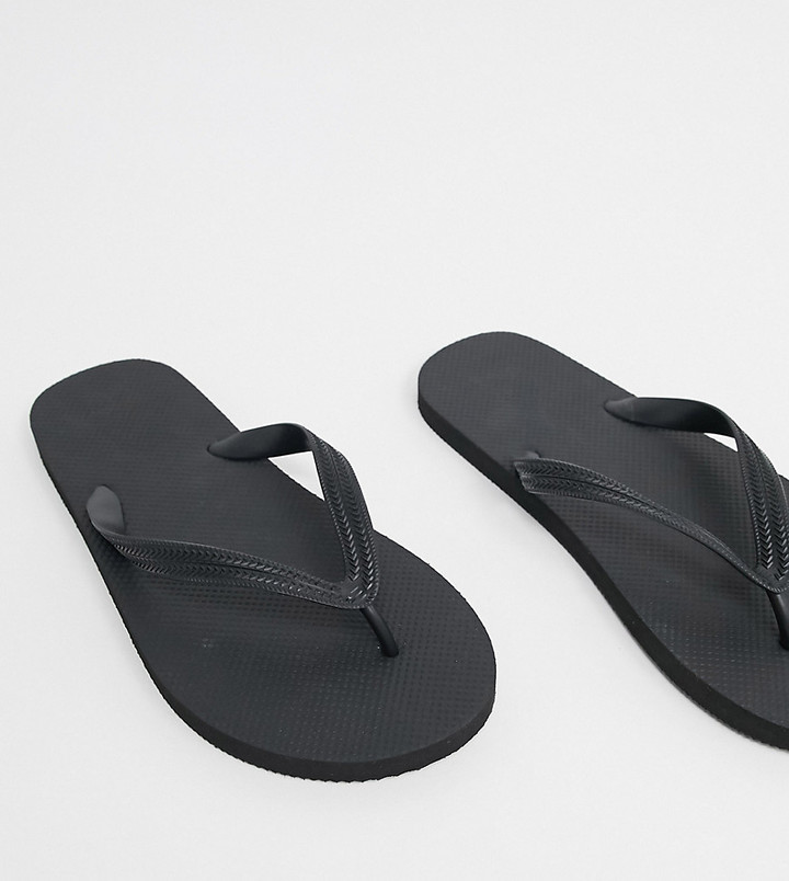 ASOS DESIGN Wide Fit flip flops in black - ShopStyle Sandals & Slides