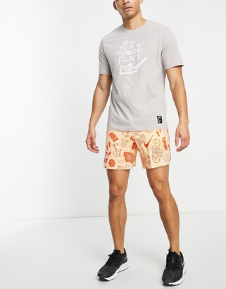 Nike Running Dri-FIT A.I.R. Nathan Bell graphic woven shorts in dusty  orange - ShopStyle
