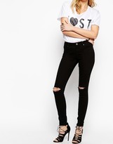 Thumbnail for your product : ASOS COLLECTION Lisbon Skinny Mid Rise Jeans in Black with Displaced Knees