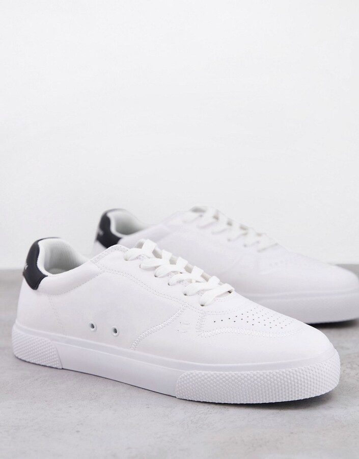 Bershka sneakers with contrast heel tab in white - ShopStyle