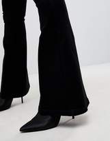 Thumbnail for your product : ASOS Petite DESIGN Petite bell flare jeans in clean black with pressed crease