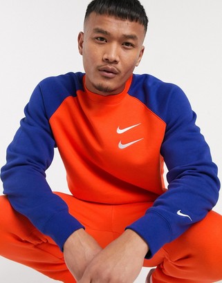 orange blue nike shirt