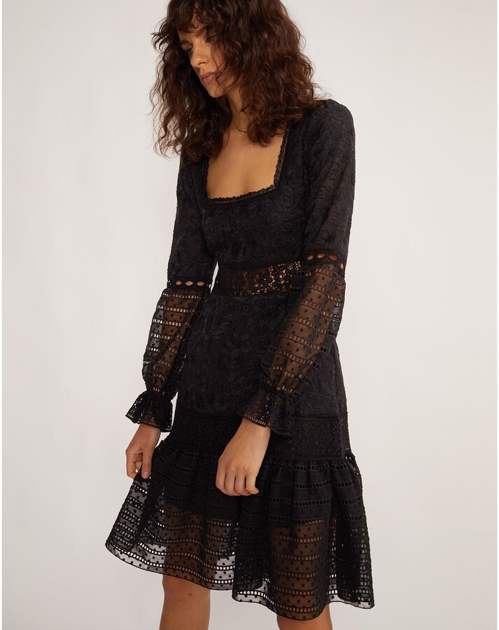 black dress with ruffles on bottom