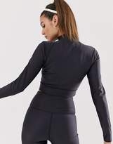 Thumbnail for your product : Nike Training cropped long sleeve t-shirt with side cut outs in black