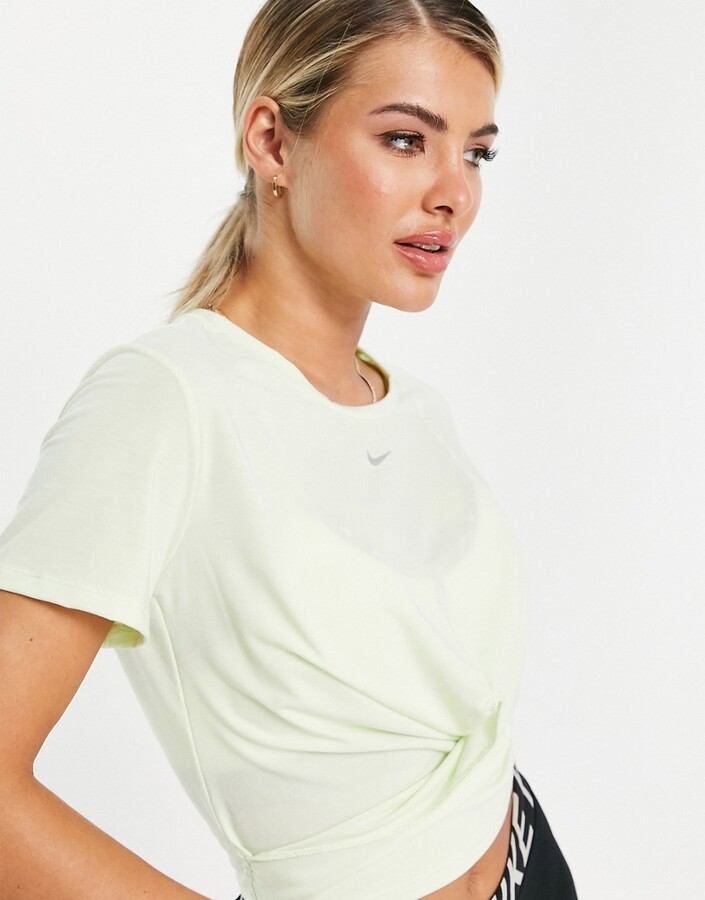 Nike Training One Luxe twist front short sleeve crop top in yellow -  ShopStyle