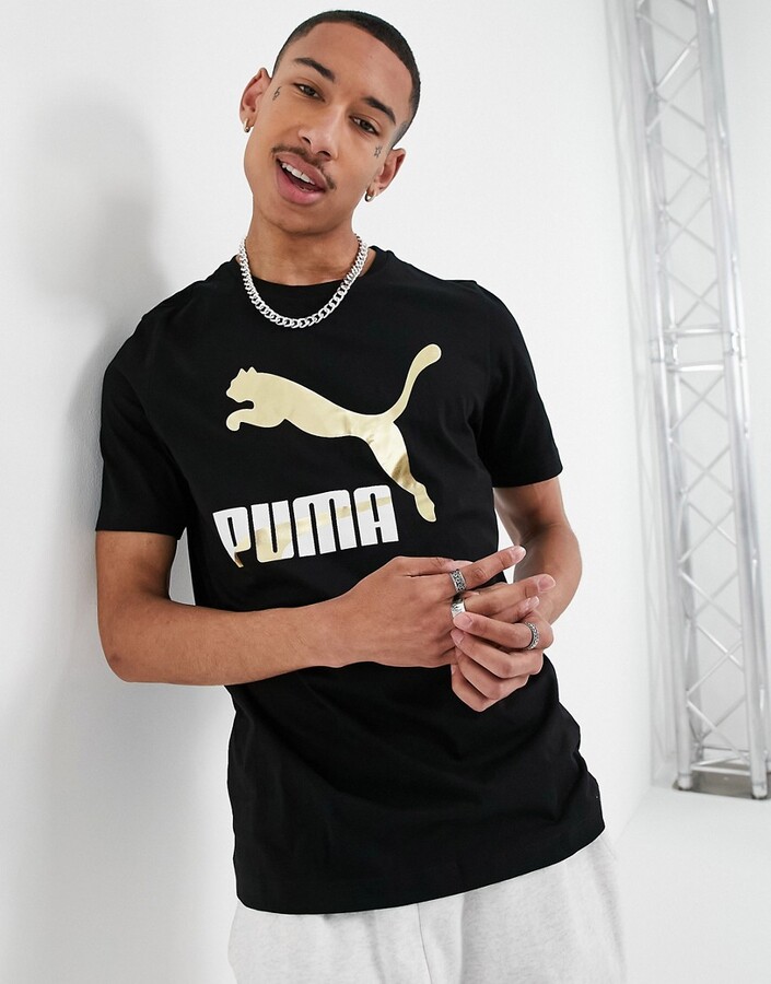 Puma Classics large logo T-shirt in black and gold - ShopStyle