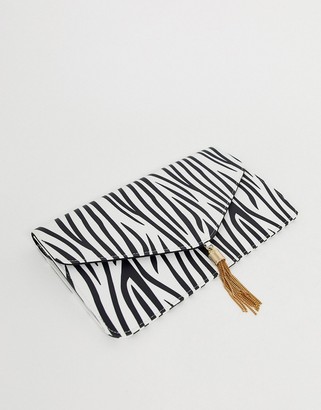 ASOS DESIGN tassel clutch bag in zebra print
