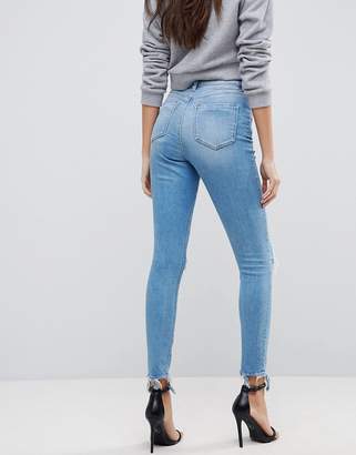 ASOS DESIGN Ridley high waist skinny jeans in mottled light stone wash with busts