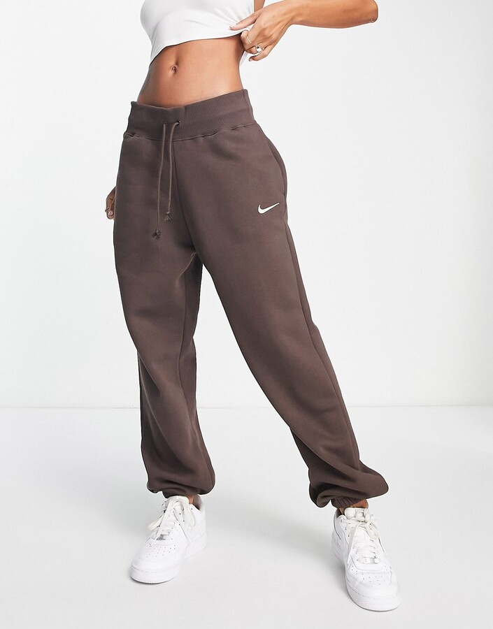 Nike Unisex mini swoosh oversized high rise joggers in baroque brown -  ShopStyle Activewear Trousers