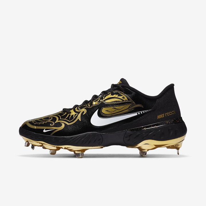 gold and black baseball cleats