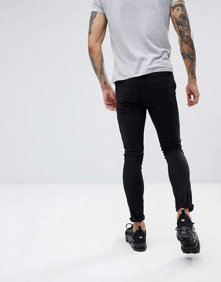 Religion skinny fit biker jeans in black with skeleton patches