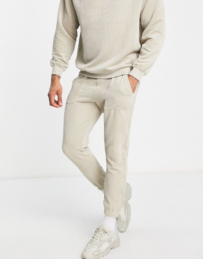 Bershka textured co-ord joggers in beige ShopStyle Trousers