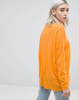 Thumbnail for your product : ASOS Design DESIGN top with v-neck in oversized lightweight rib in orange
