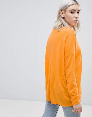 ASOS Design DESIGN top with v-neck in oversized lightweight rib in orange