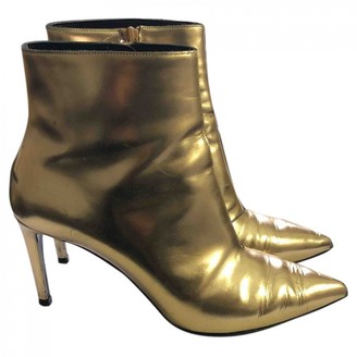 Balenciaga Slash Gold Leather Ankle boots - ShopStyle