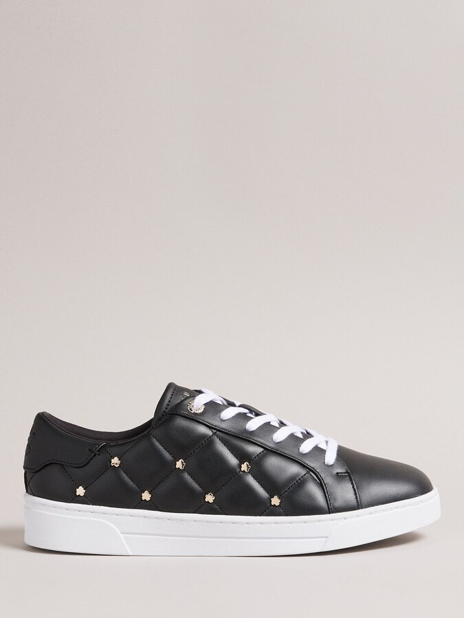 black trainers with studs