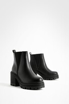 mixed check block heel cleated biker boot
