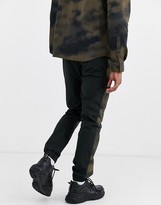 Thumbnail for your product : ASOS DESIGN two-piece skinny sweatpants with elastic waist and printed side stripe in black