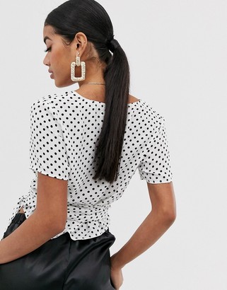 NA-KD polka dot wrap front crop top in white