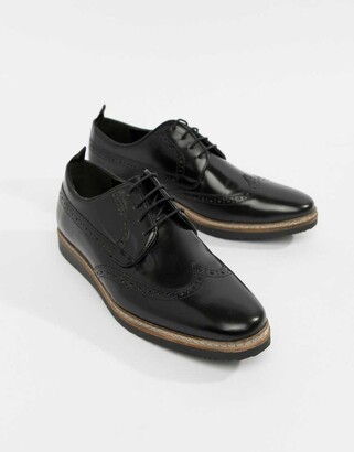 black wedge brogues