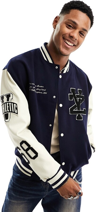 ASOS DESIGN oversized varsity bomber jacket in navy with faux leather  sleeves