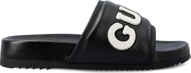 Gucci Logo Embossed Slides - ShopStyle Flip Flop Sandals