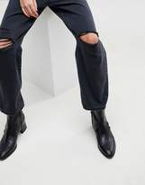 Thumbnail for your product : ASOS Design DESIGN barrel leg boyfriend jeans in washed black with knee rips
